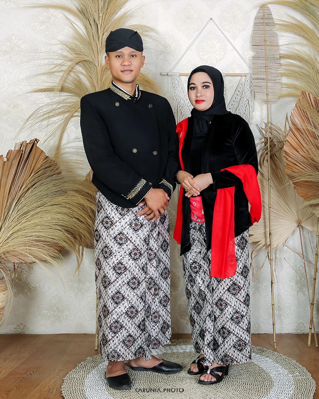 Bride and groom-to-be holding hands and walking along city streets with romantic bokeh lights